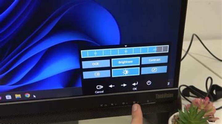 How do I adjust my webcam light?