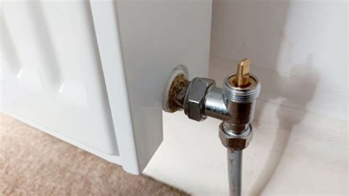 How do you open and close a radiator valve?