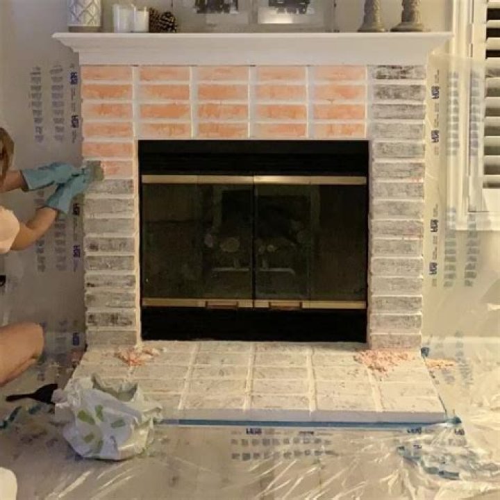 How do you remove old paint from a brick fireplace?