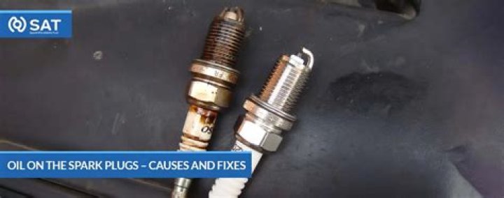 What happens when oil leaks into the spark plugs?